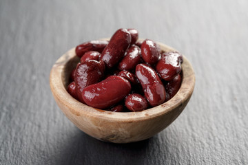 red beans from can in wood bowl