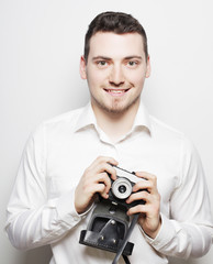 young  photographer over white background