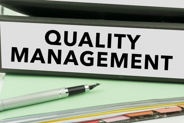 Quality Management - Ring Binder in the office. Management file. Business Concept