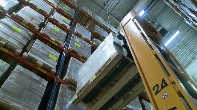 View on modern forklift in production warehouse