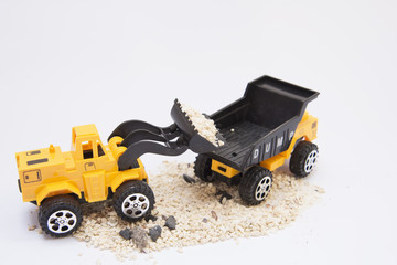 Fototapeta na wymiar Toy cars are digging