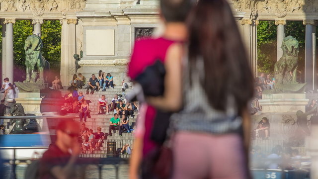 Tourists on boats at Monument to Alfonso XII timelapse in the Parque del Buen Retiro - Park of the Pleasant Retreat in Madrid, Spain