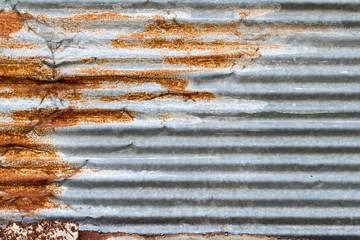 A background of peeling paint and rusty old metal