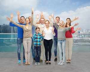 Obraz premium group of smiling people waving hands