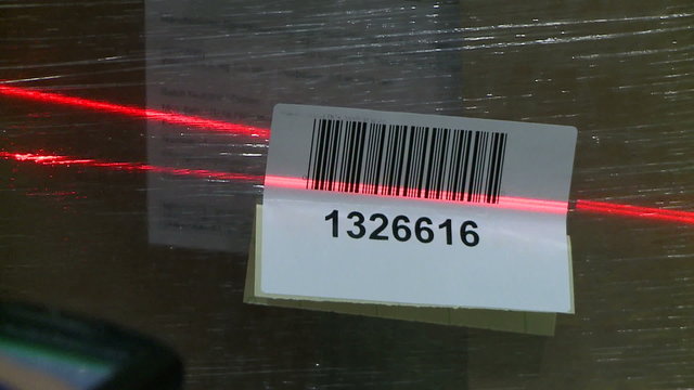 View of scanning box with laser barcode reader