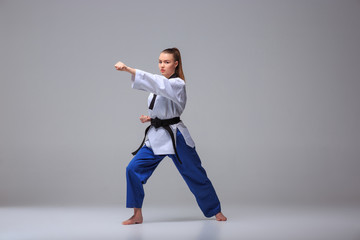 The karate girl with black belt 