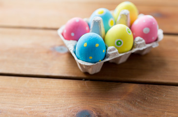 Fototapeta na wymiar close up of colored easter eggs in egg box