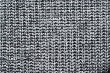 Grey knitted sweater texture background. Space for copy, text, lettering.