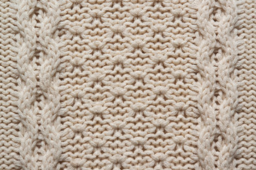 Beige white knitted sweater texture background. Space for copy, text, lettering.