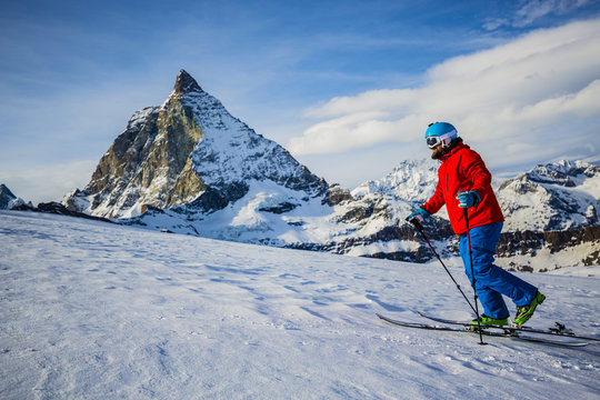 Ski tour - skier climbing to the top