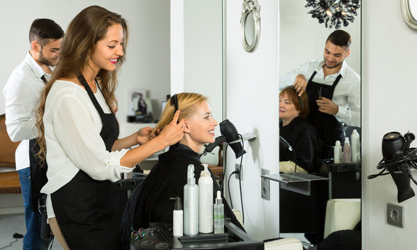 Hair stylists working in salon