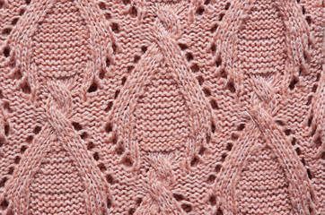 Salmon pink, beige knitted sweater texture background. Space for copy, text, lettering.