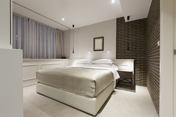 Modern bedroom interior in the evening