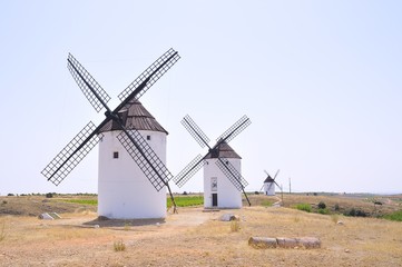 Obraz na płótnie Canvas View on three windmills at field
