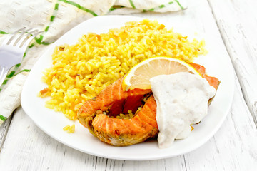 Salmon with lemon and rice on board