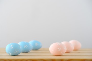 Close up of Easter eggs on a wooden table.