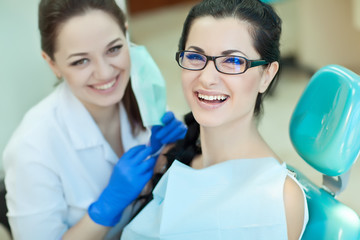 doctor and patient in dentist office 