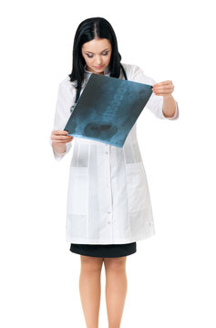 Female doctor examining an x-ray picture
