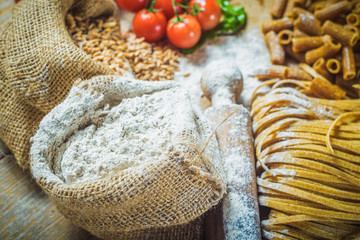 Integral components of tagliatelle pasta ingredients and tomatoe