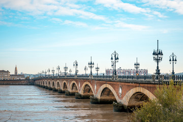 Fototapeta na wymiar Bordeaux river bridge with St Michel cathedral