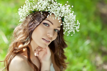 Beautiful woman with bunch in a nature