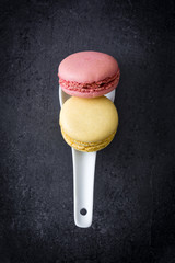 Macarons in a spoon on slate
