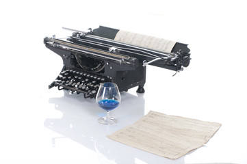Old typewriter on wood on a blue background