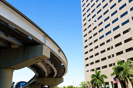 elevated commuter tracks with automated train car in Miami