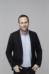 Confident guy in jacket, studio shot