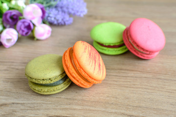 colorful macaroons on wooden table