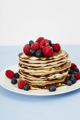 Stack of fresh pancakes with fruit