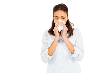 Woman blowing nose with tissue paper 