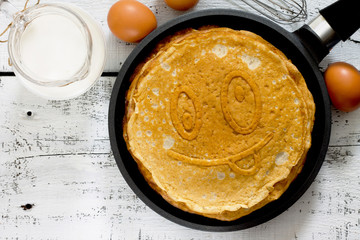 A stack of pancakes in a frying pan, traditional for Russian Car