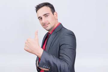 Businessman approving holding his thumb up 