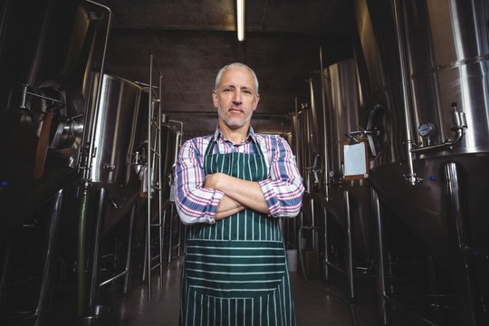 Portrait of brewer standing at brewery