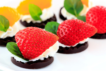 fruits on the chocolate with whipped cream