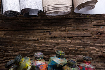 Vintage stylized photo of oil multicolor paint tubes closeup and