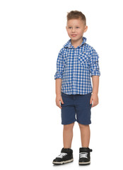 Beautiful little blond boy with a fashionable haircut, blue shorts and blue plaid shirt - Isolated on white background