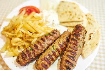 Grilled sausages with fries, barbecue