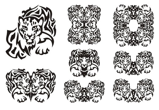 Tribal leopard symbols. Set of the double flaming symbols of the head of a young leopard. Black on the white