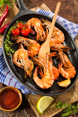 Fried king prawns on iron pan