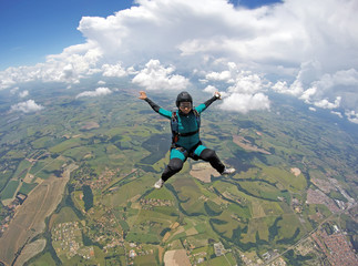 Skydiver woman falling in sitting control