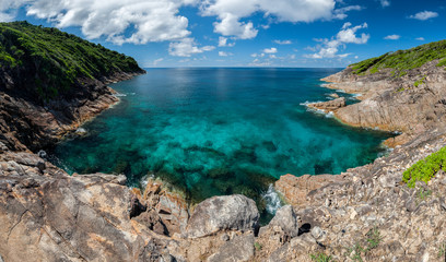 Landscape,clear water,blue sky at The cliff & blue sea at the Island in Andaman Sea, Thailand
