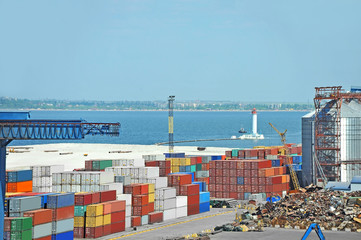 Port cargo crane and container over blue sky background