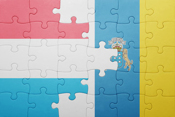 puzzle with the national flag of canary islands and luxembourg
