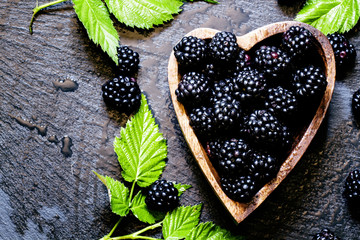 Blackberries in bowl in the shape of a heart, a top view
