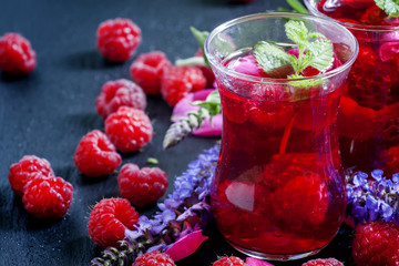 Herbal red tea with raspberries, mint, sage flowers and rose pet