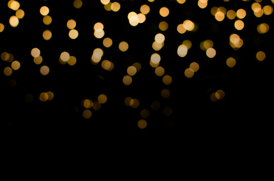 abstract golden yellow colorful circle blur bokeh lights for Christmas festival background. defocused picture