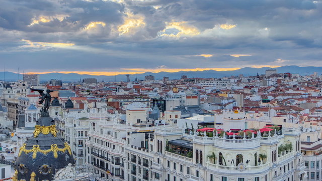 Panoramic aerial view of Gran Via timelapse before sunset, Skyline Old Town Cityscape, Metropolis Building, capital of Spain, Europe.