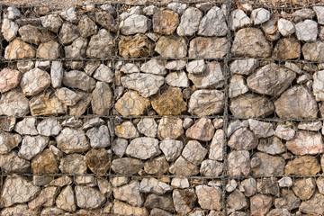 Stone construction with steel mesh which was dam embankment eros